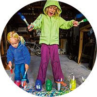 Kids painting in a garage