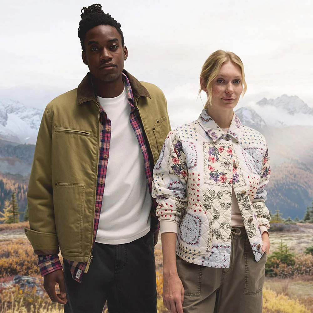 Young couple in autumn mountain landscape