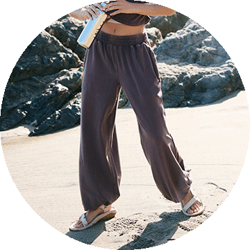 Woman wearing grey pants.