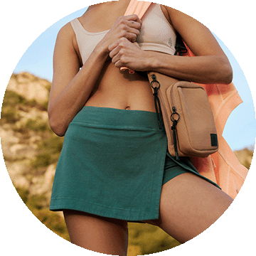 Close up of woman wearing green shorts.