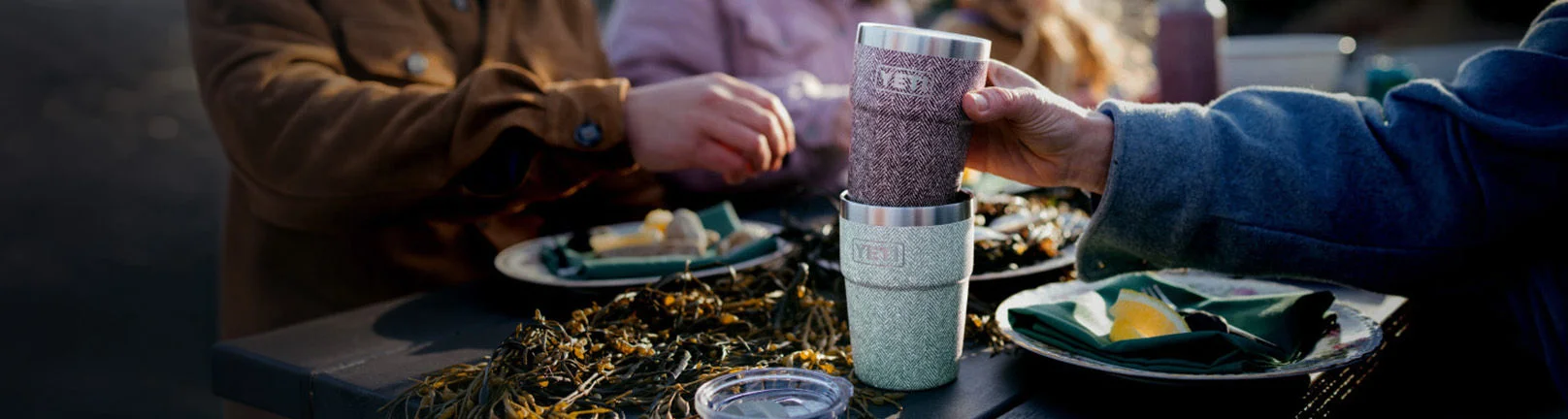 YETI cups stacked up on a table.