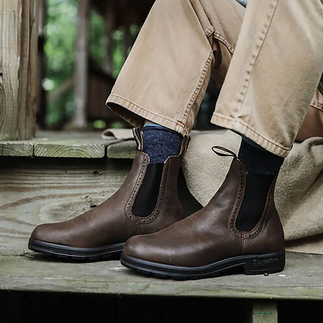 Brown leather ankle boots on porch steps