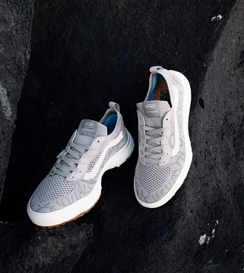 Light grey shoes with a white stripe.