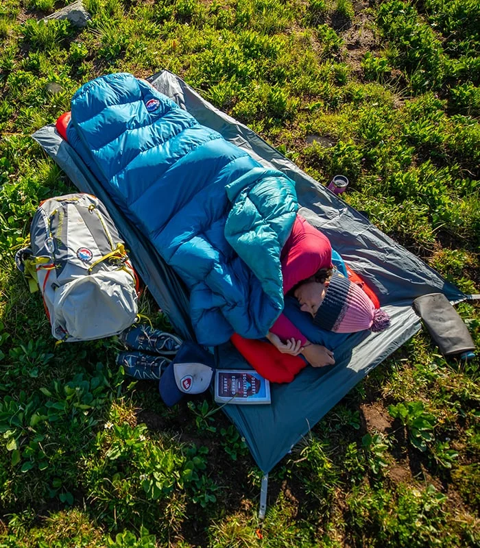 Woman in a sleeping bag.