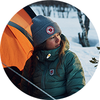 Woman wearing a grey beanie. 