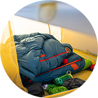 Person sleeping in a sleeping bag.