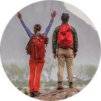 Two people looking at a mountain