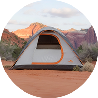 Camping tent in desert canyon landscape
