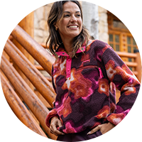 Smiling woman in floral fleece outdoors