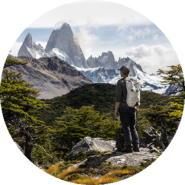 Man looking into the distance at mountains.