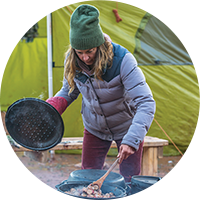 Woman cooking outside