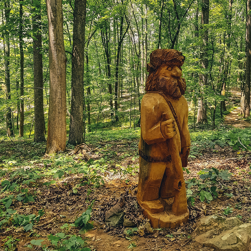 A sculpture of a man along a hike in Ragged Mountain Natural Area