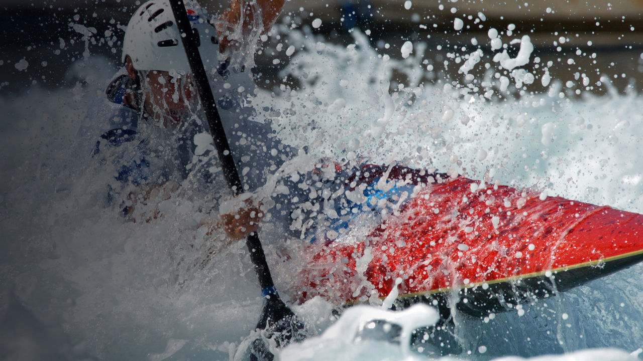 A kayaker races through the rappids.