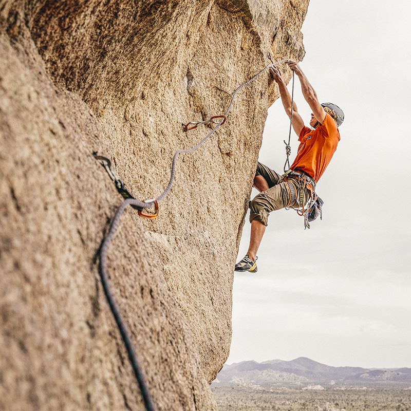 A man climbs on Sole Fusion (5.12a) in Joshua Tree National Park.