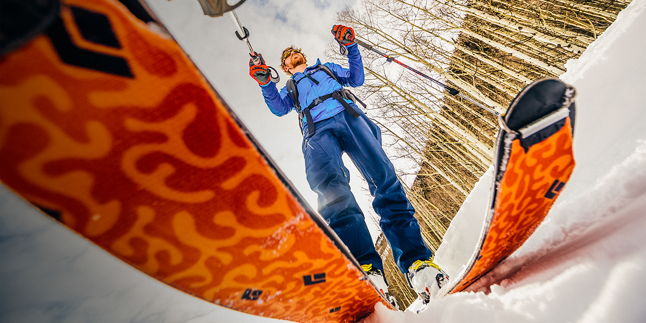 A man with Alpine skis