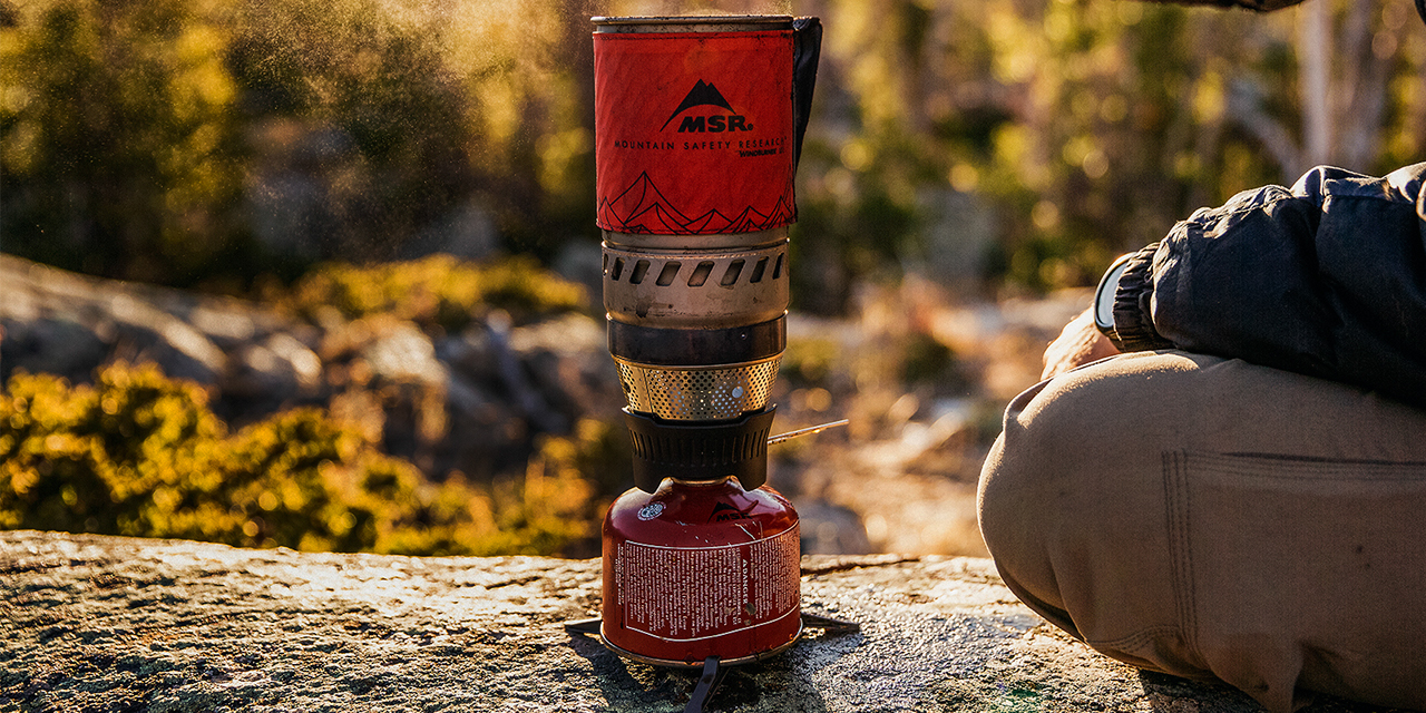Closeup of gas cooking device at a campsite