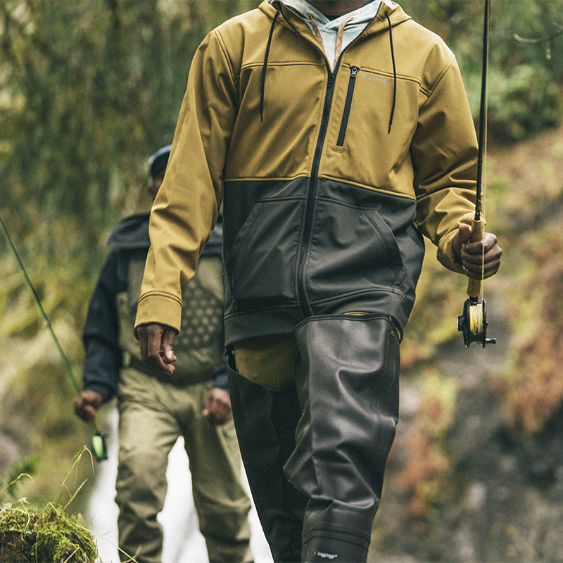 A detail of Fishermen with fishing poles along a river 