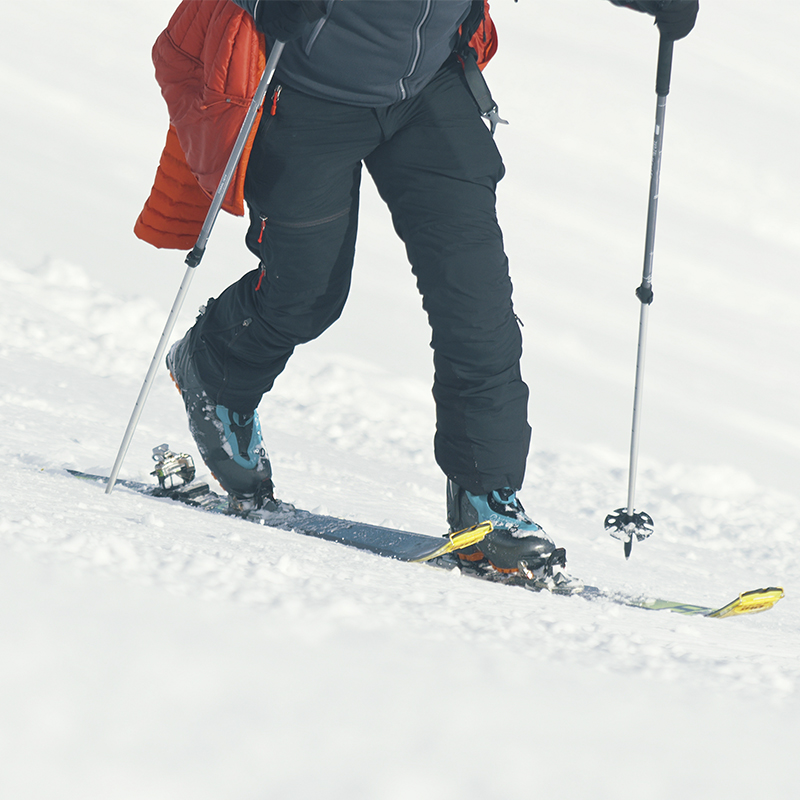 A close up of a person cross country skiing
