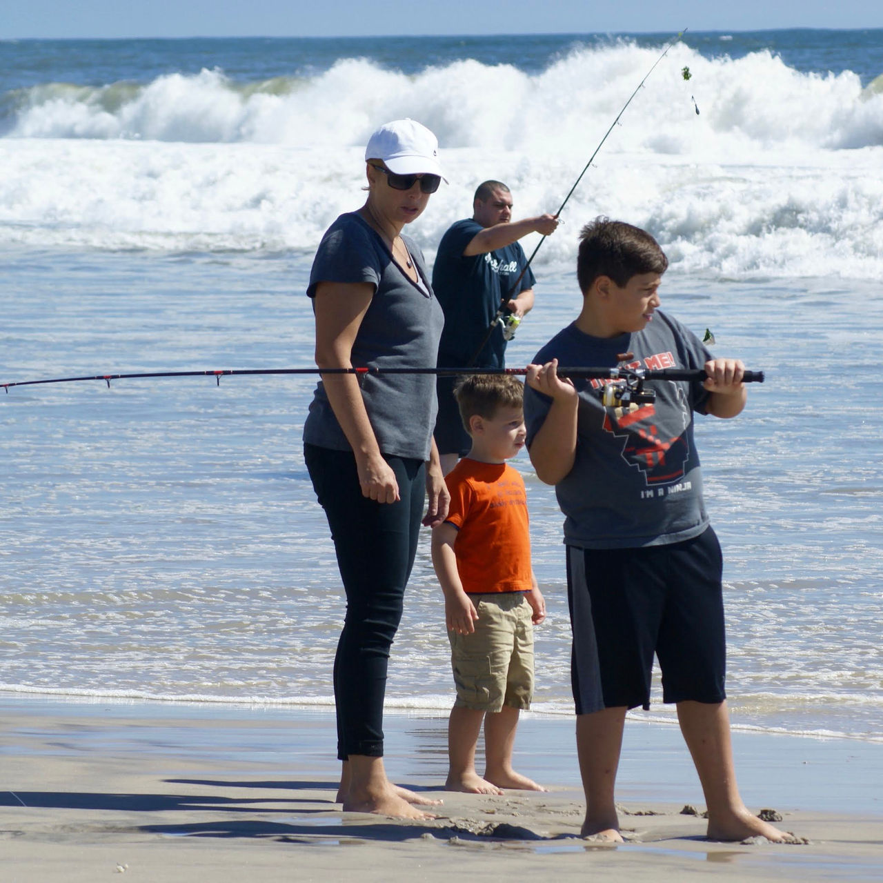 Fire Island National Seashore: A young boy learns to surfcast with his family on a sunny summer day. Fire Island National Seashore partners with the New York State Department of Environmental Conservation to offer free family fishing clinics. 
