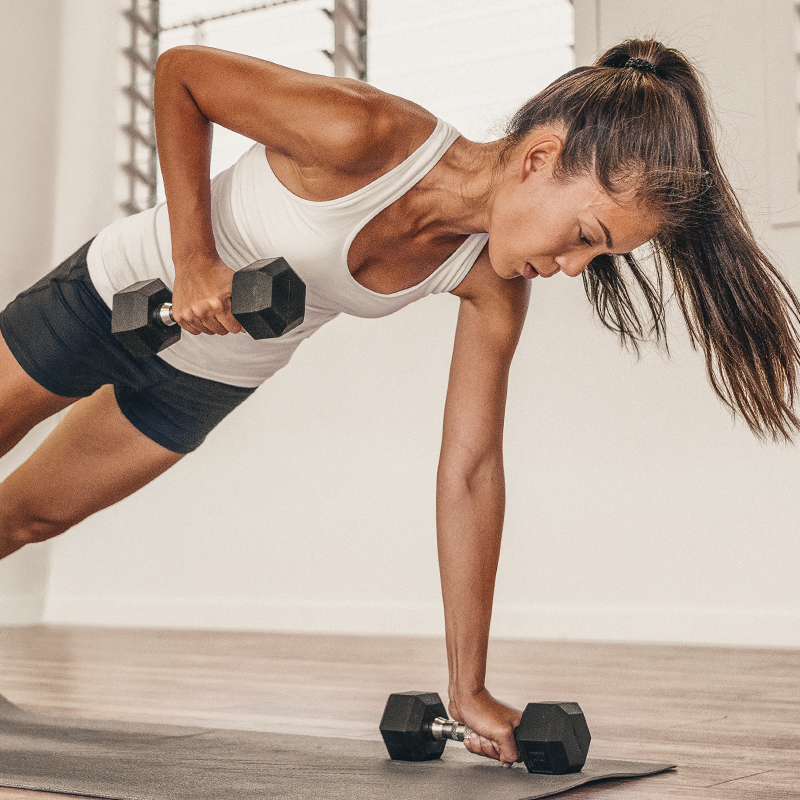 A woman does Renegade Rows with weights