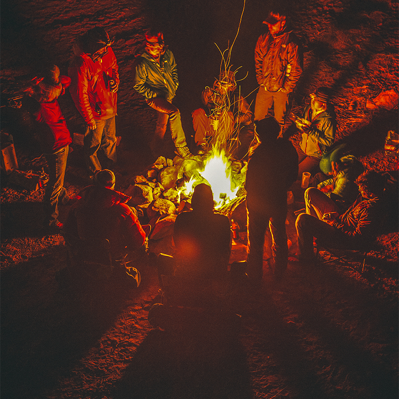 A group gathers around a campfire in Southern Utah