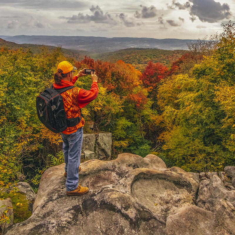 A woman hiking along the  Laurel Highlands Hiking Trail (LHHT)