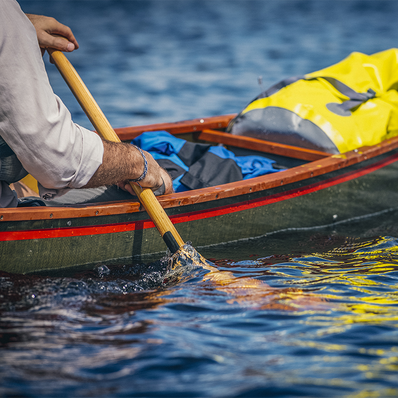 A man paddles on Flagstaff Lake, Maine