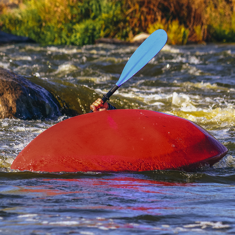 Overturn (capsize) man in kayak in whitewater river