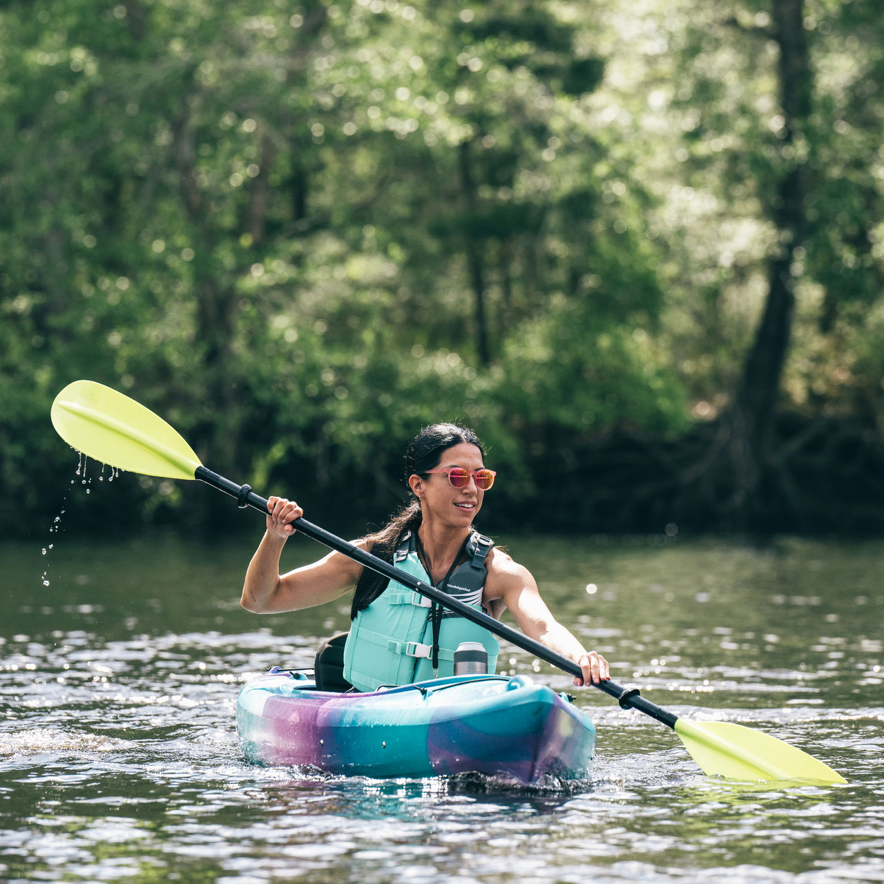 A woman paddles in a kayak