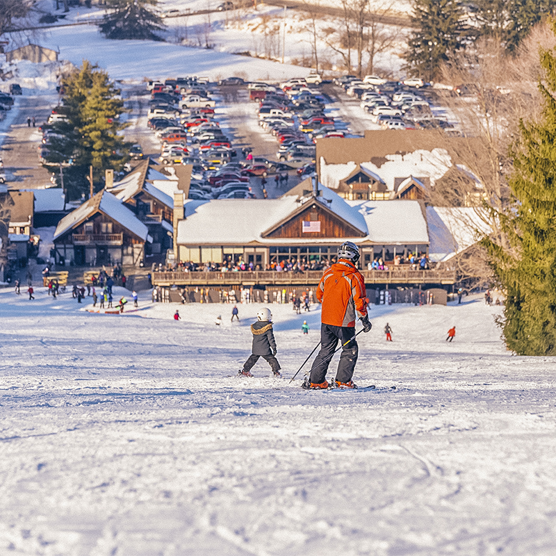 Skiers and snowboarders at Snow Trails