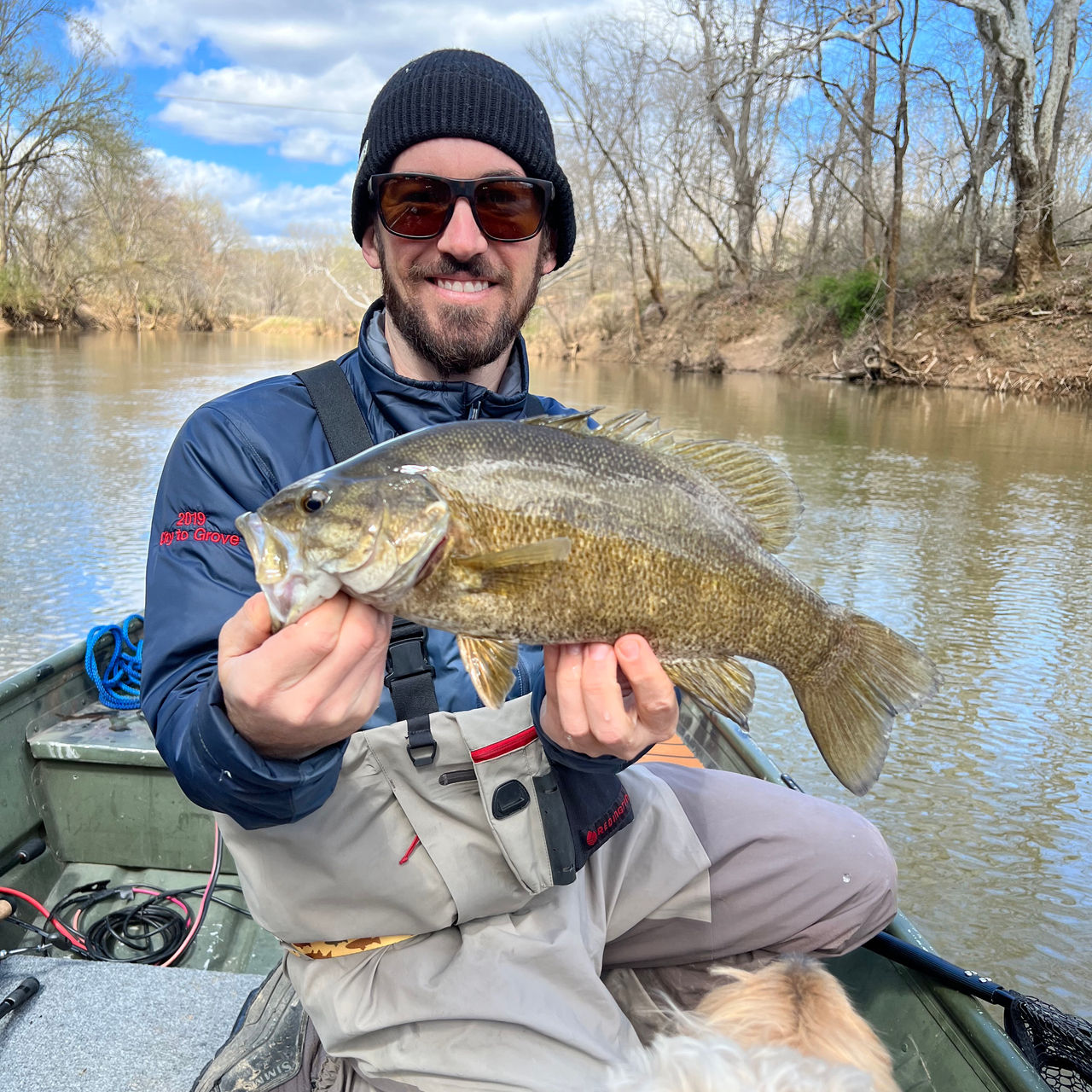 A fisherman holds a smallmouth on Virginia’s Historic James River
