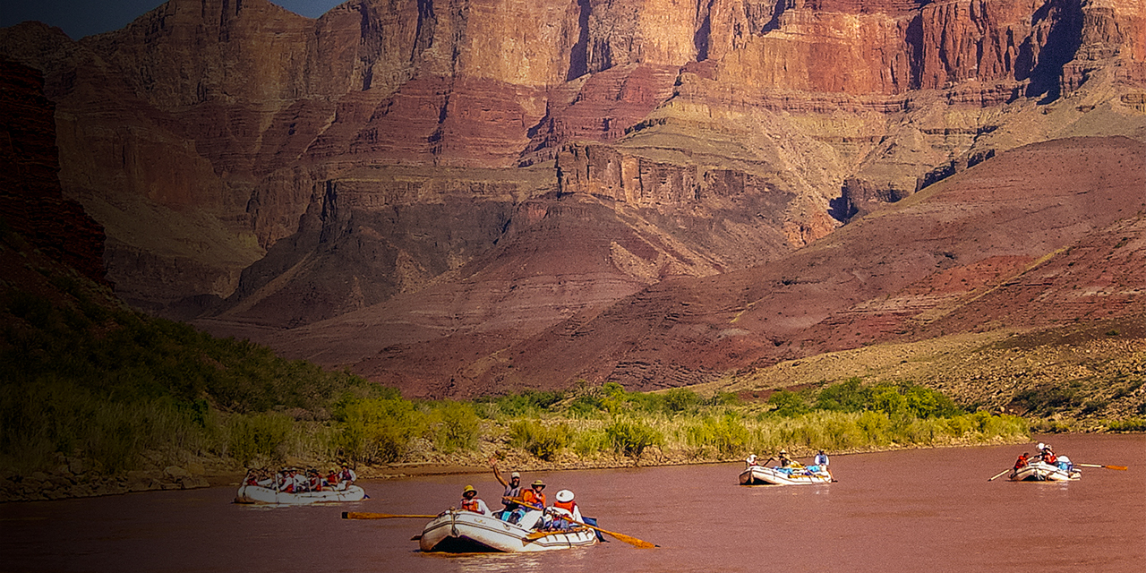 A commercial raft trip on the colorado river passes cardenas creek in grand canyon national park.