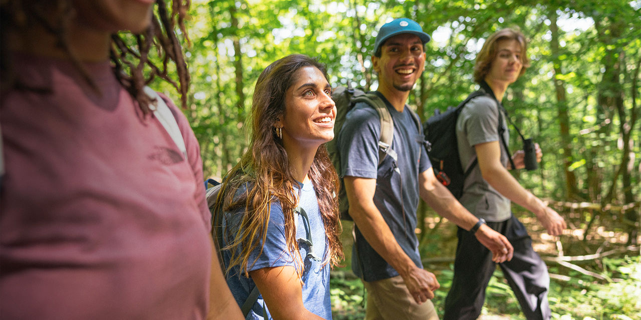 A group of friends hike together