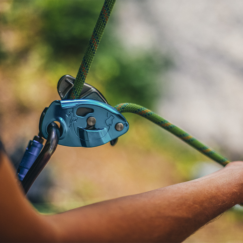 A belayer belaying from a Grigri
