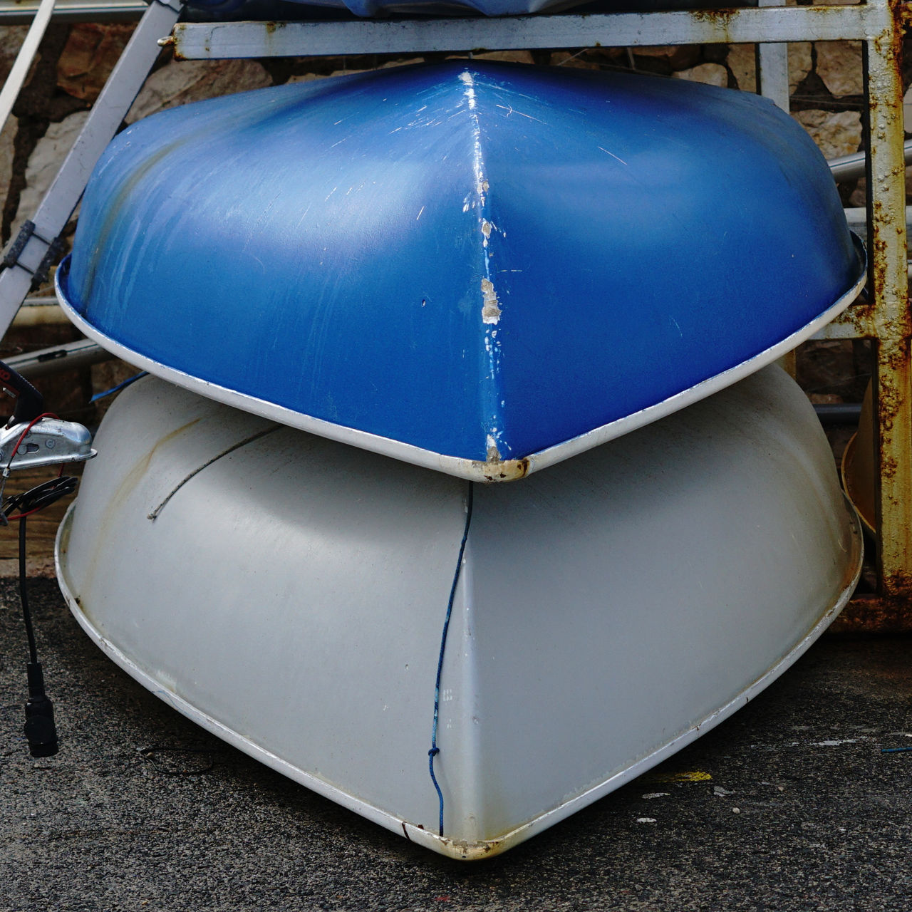 kayaks and canoes stacked in the dry marina