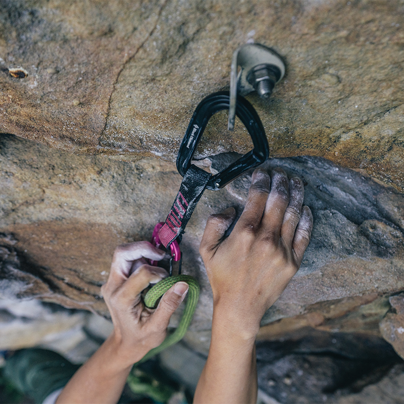Carabiner attached to a climbing anchor