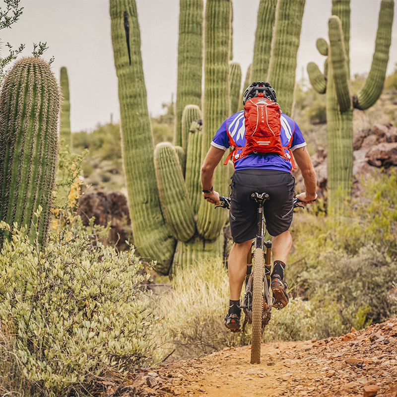 A biker rides Black Canyon's single track in Arizona with a hydration pack