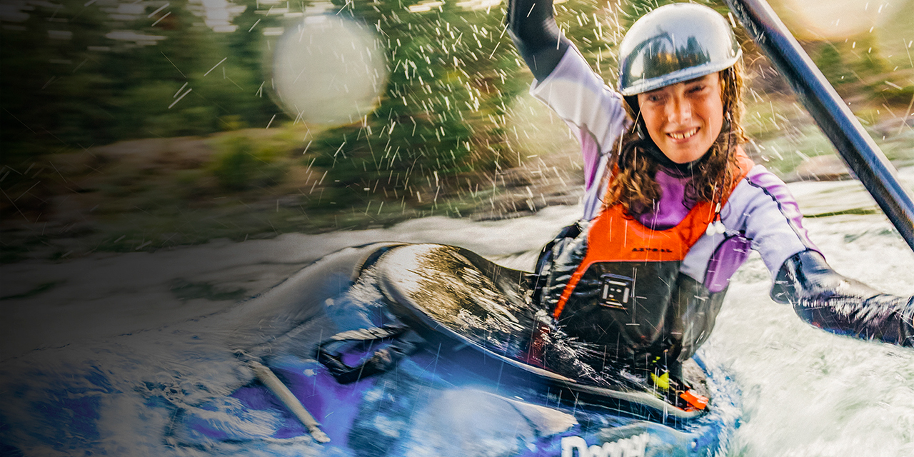 A teenage girl recreational whitewater kayaking in Idaho