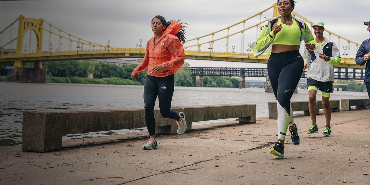 Group of runners downtown wearing jackets