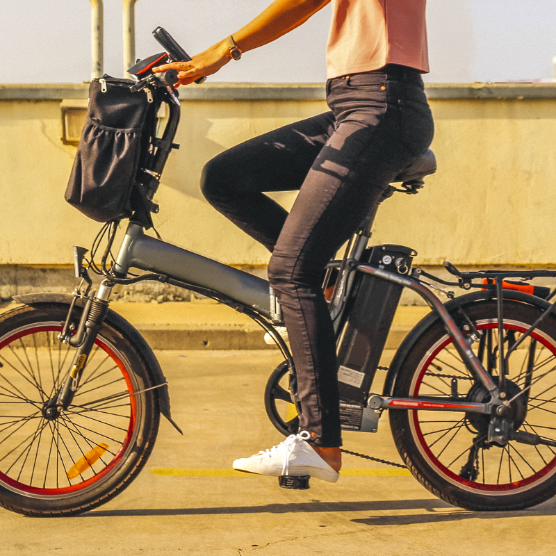 A young woman riding a road electric bicycle