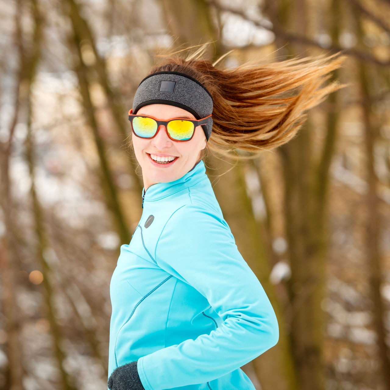 Girl dressed for exercising in winter with sunglasses