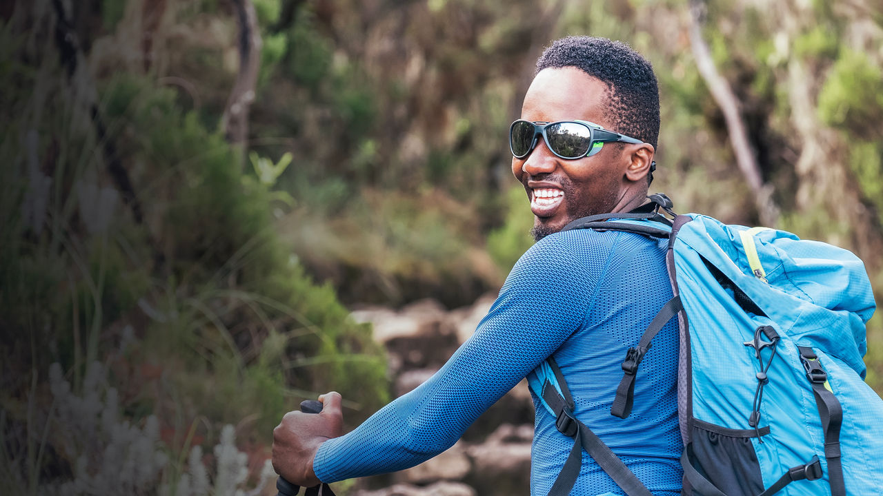 Portrait of a smiling young man in sunglasses.