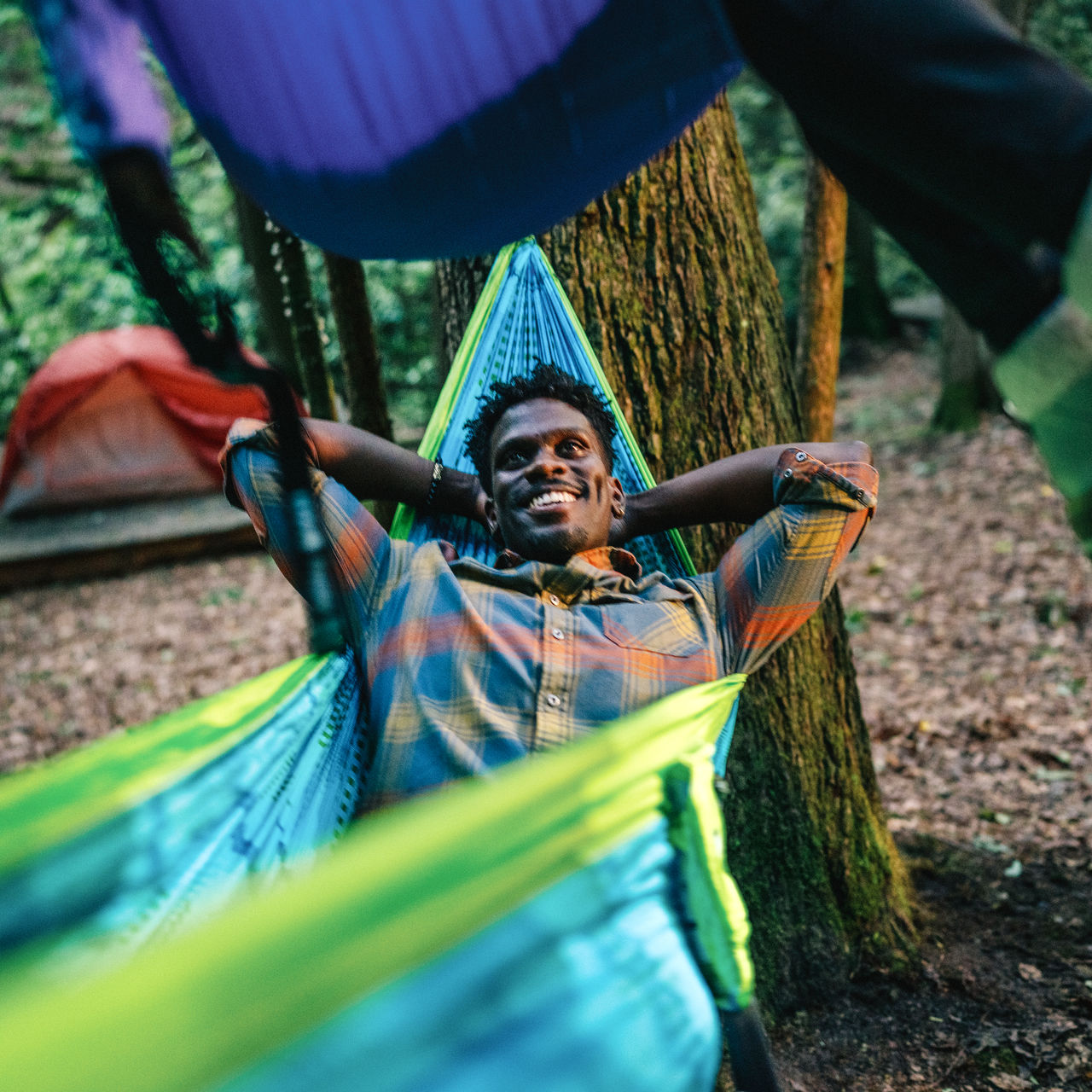 A man lays in a hammock