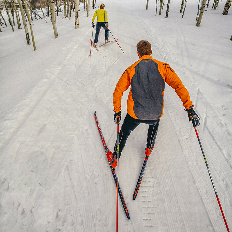 A man and a woman skate skiing at the White Pine Touring Center, Park City, Utah.