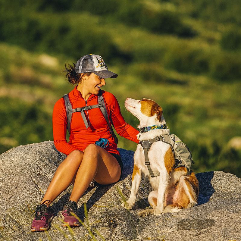 A woman smiles at her dog near the John Muir Wilderness along the McGee Creek Trail in the Inyo National Forest in California.