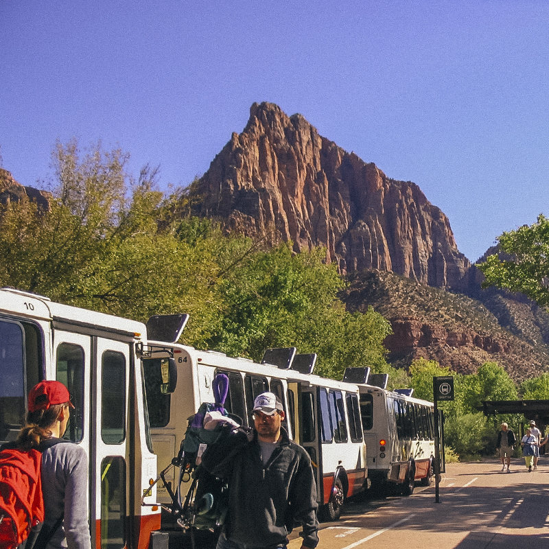 Visitors exit and enter the Zion Canyon Shuttle System