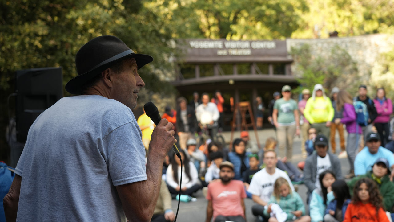 Ken Yager speaking in front of a crowd