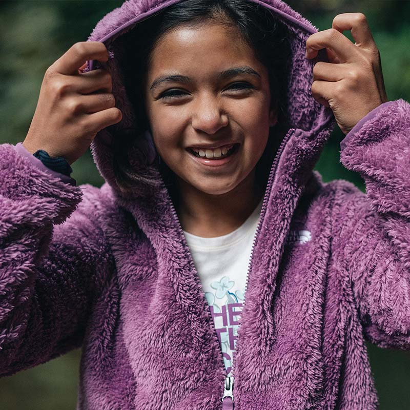 Girl wearing fuzzy mid-layer jacket