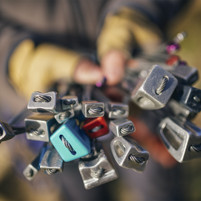 A person holds out climbing nuts