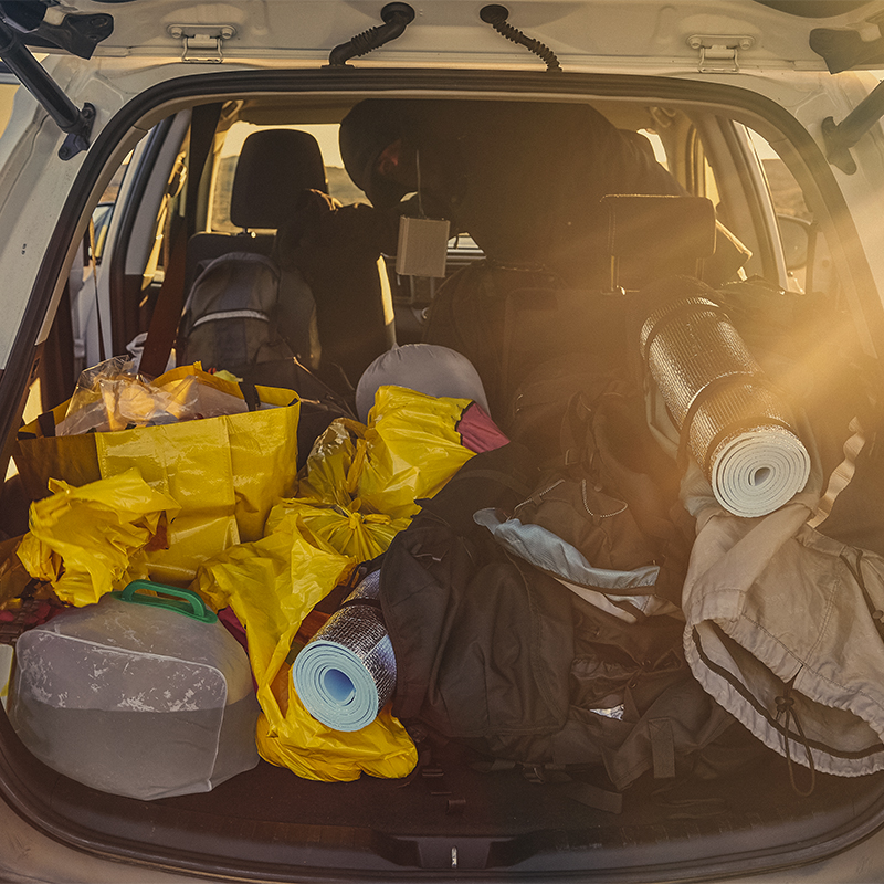 Trunk of a car loaded with travel camping equipment in Iceland